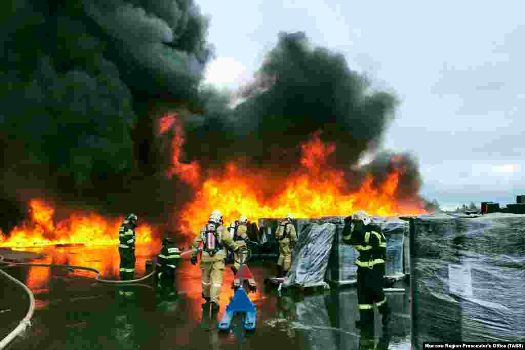 Firefighters battle a blaze at a fertilizer storage facility in Ramenskoye, near Moscow, on August 13. 