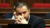 Armenia - Economy Minister Vahan Kerobian attends a session of the Armenian parliament.