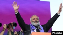 Archbishop Bagrat Galstanian greets supporters rallying in Yerevan on May 26.