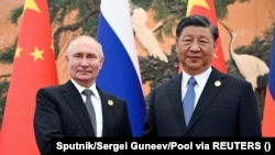 Сӣ Ҷинпин, раиси ҷумҳури Чин бо Владимир Путин, президенти Русия