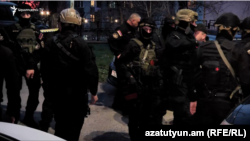 Armenia - Members off a special security force are seen outside a police station in Yerevan, March 24, 2024.