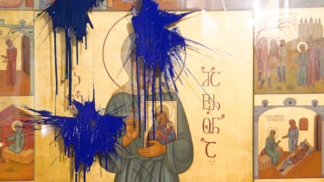 She Threw Paint On A Religious Icon Showing Stalin. Then A Mob Arrived.