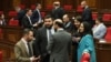 Armenia - Deputies from the ruling Civil Contract party talk on the parliament floor, Yerevan, March 1, 2023.