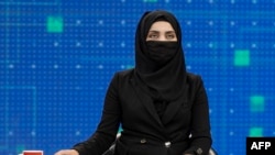 Ооганстандагы телеканалдын алып баруучусу. 