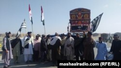 Activists of Pakistani political parties Jamiat Ulam-e Islam and Pashtunkhwa Milli Awami Party block a road leading to the southwestern city of Quetta, the capital of Balochistan Province.