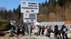Refugees crossing the border from Ukraine to Poland arrive to a reception point, fleeing the Russian invasion of Ukraine, at a border checkpoint in Kroscienko, Poland, March 17, 2022.