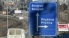 Kosovo - A board reading "Independence" is seen behind a road sign the entrance of Pristina on February 15, 2008.