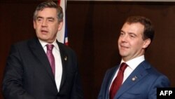 Gordon Brown (left) and Dmitry Medvedev at the G8 summit in Tokyo in July