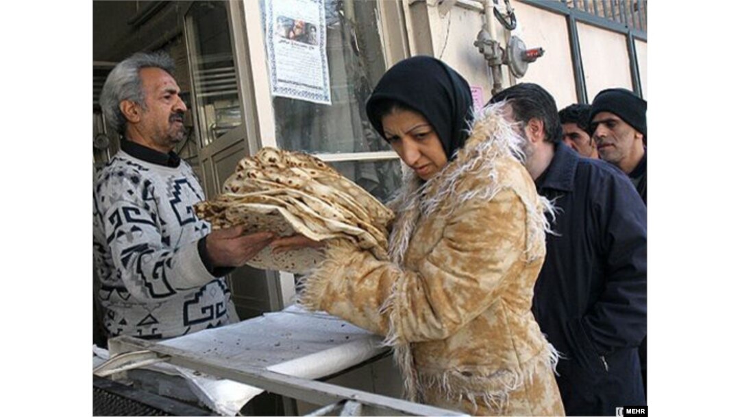 Iran - Iranians queue at a bakery in Tehran to buy traditional bread.
