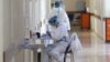 Armenia -- A medical worker takes notes at the Surp Grigor Lusarovich Medical Center in Yerevan, the country's largest hospital treating coronavirus patients, June 5, 2020.