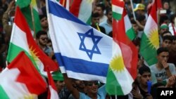 برخی راهپیمانان حامی استقلال در کردستان عراق پرچم اسرائیل به دست داشتند
