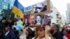 ISRAEL – A woman holds a sign at a rally in support of Ukraine, after Russia launched a massive military operation against Ukraine, on Rothschild Boulevard in Tel Aviv, Israel, February 26, 2022