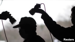 A man is tested for possible nuclear radiation at an evacuation center in Fukushima