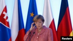 Ангела Меркель (на встрече с "Вышеградской четверкой" (Варшава, 26 августа 2016 года)
