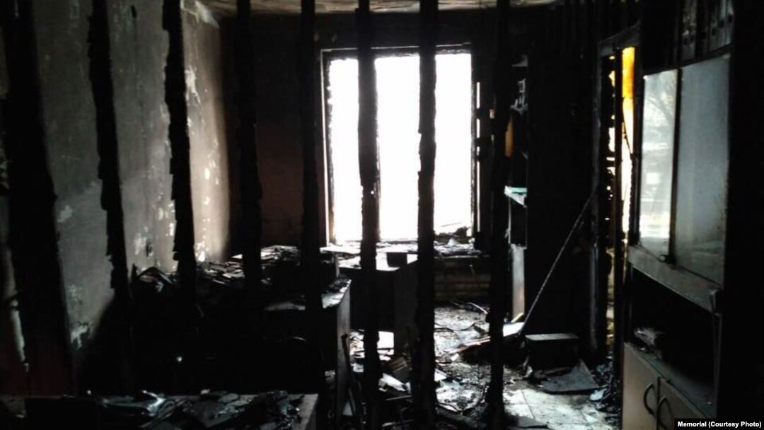 A senior staff member with Memorial has linked the fire in Ingushetia with pressure that the rights group has come under in neighboring Chechnya, where the head of the rights group's office has been arrested on a drug-possession charge.