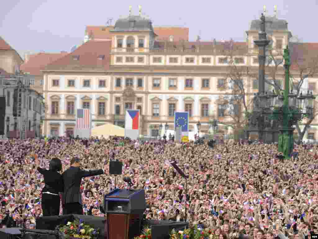 The Obamas wave to a crowd of around 30,000 people after the president's speech outside Prague Castle on April 5. - The U.S. president used his open-air address in the Czech Republic to press his goal of nuclear disarmament, declaring "clearly and with conviction, America's commitment to seek the peace and security of a world without nuclear weapons."