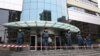 Armenia -- Police officers guard the entrance to the Erebuni Plaza Business Center after a gunman opened fire there, Yerevan, January 23, 2020. 