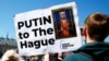 Protesters rally outside the International Court of Justice at The Hague to demand the arrest of Russian President Vladimir Putin on May 7, 2024.