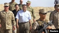 U.S. Secretary of Defense Leon Panetta (center) meeting NATO troops in Afghanistan earlier this month. Sixty-nine percent of Americans now say the United States should not be involved in the war there.