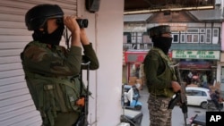Indian soldiers guard at a market in Srinagar in Indian controlled Kashmir.