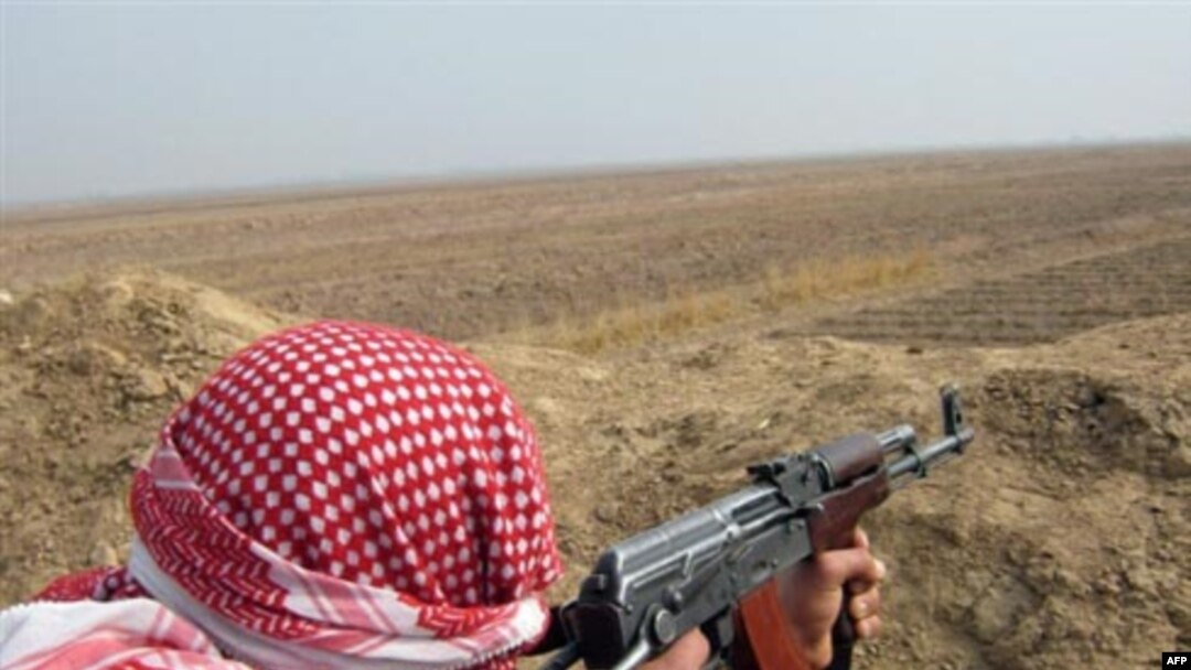 A member of an antiterrorist militia stands guard. Anbar Province has benefitted organized Sunni militias.
